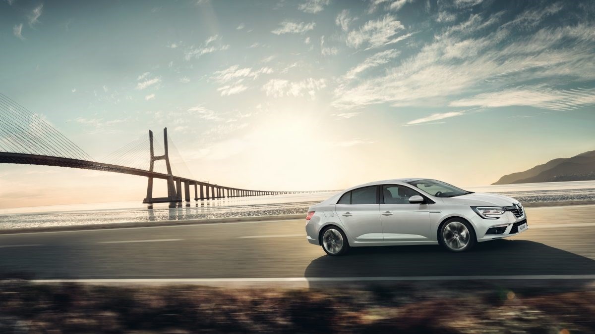 Renault MEGANE moving near coastal road
